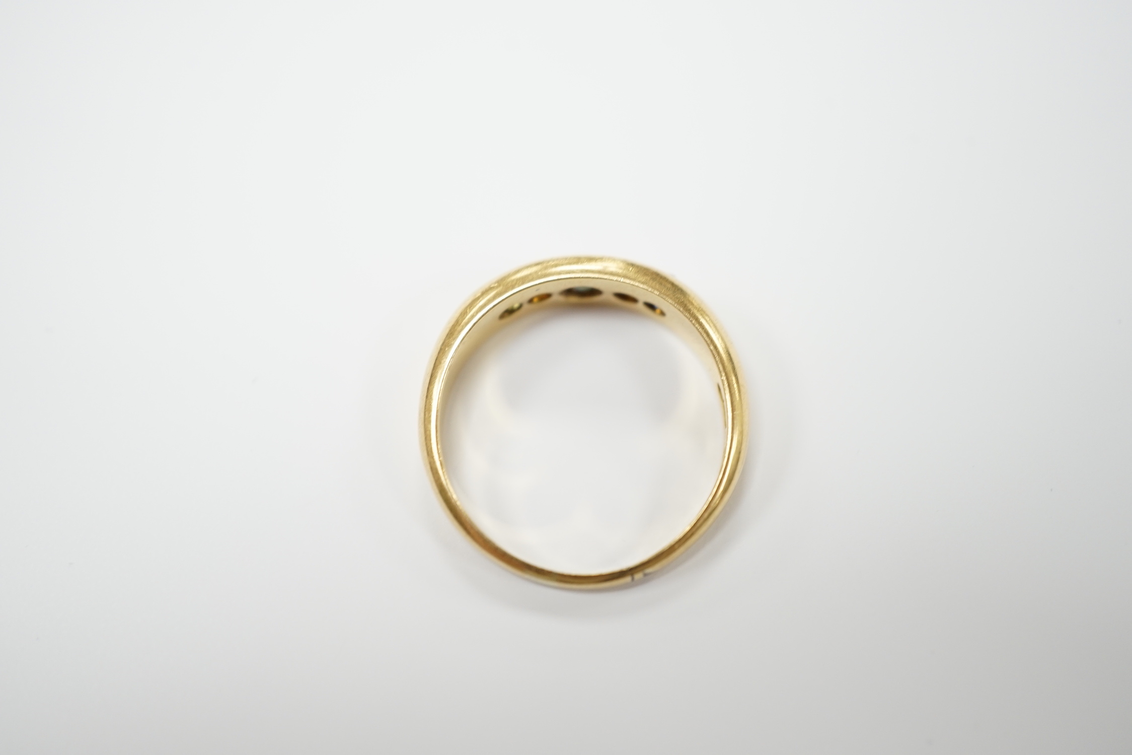 A George V 18ct gold, three stone sapphire and two stone diamond set half hoop ring, size N, gross weight 4 grams.